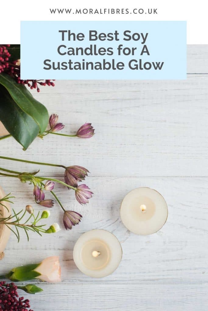 Two candles on a white background with some purple flowers and a blue text box that says the best soy candles for a sustainable glow