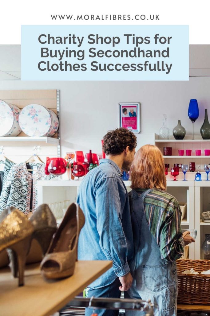 Image of a couple in a charity shop with a blue text box that says charity shop tips for buying secondhand clothes successfully.