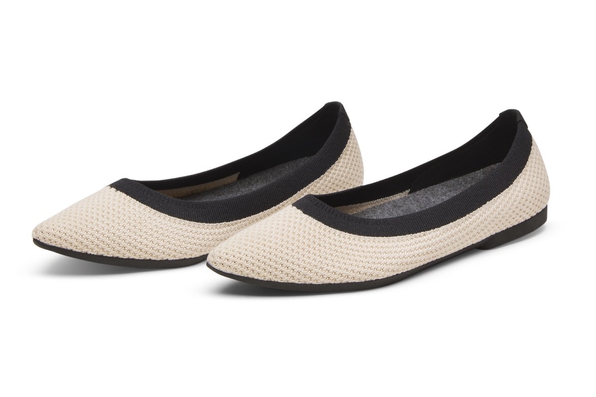 Allbirds women's flat shoes in cream and black.