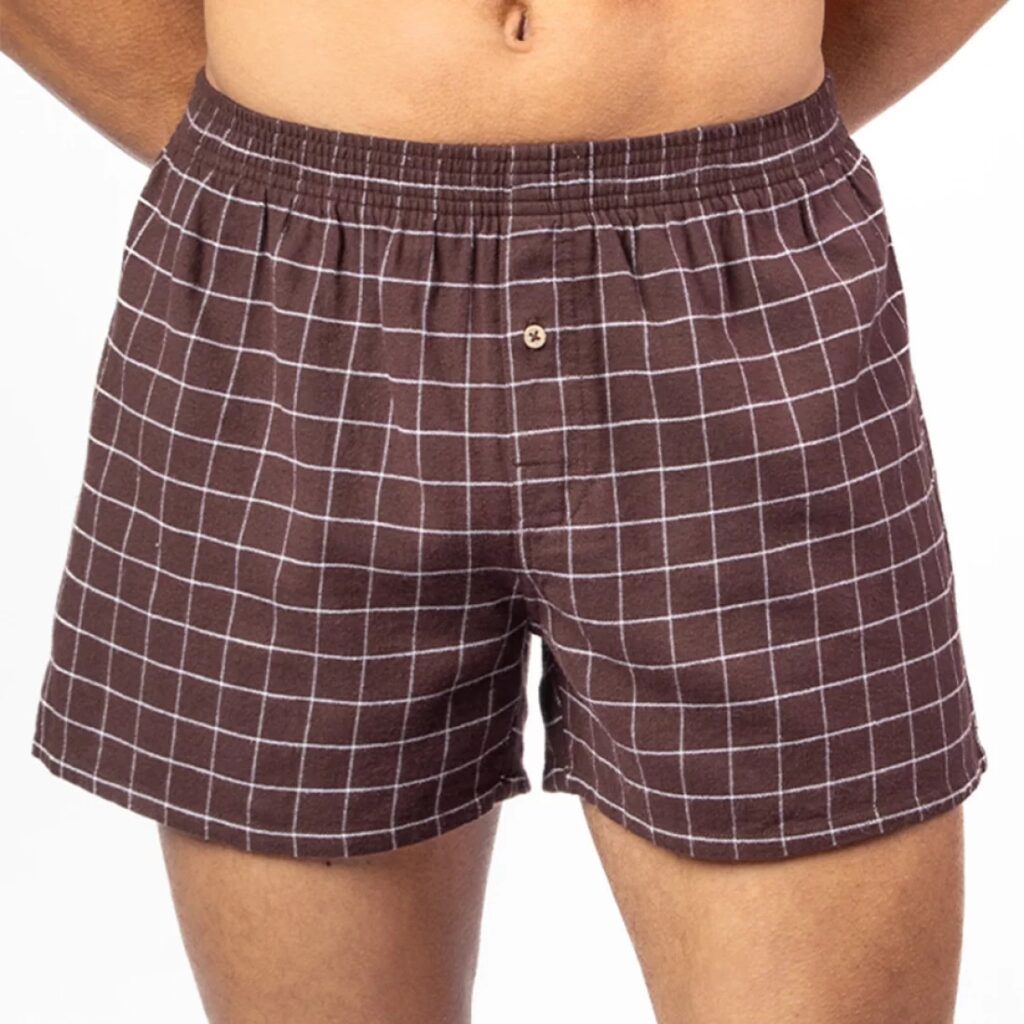 Person wearing brown check organic cotton loose boxer shorts