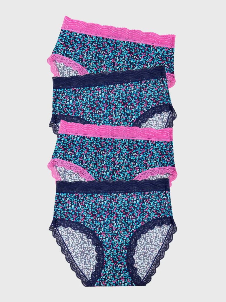 Pack of four navy and pink floral knickers from Stripe & Stare laid out flat on a beige background.
