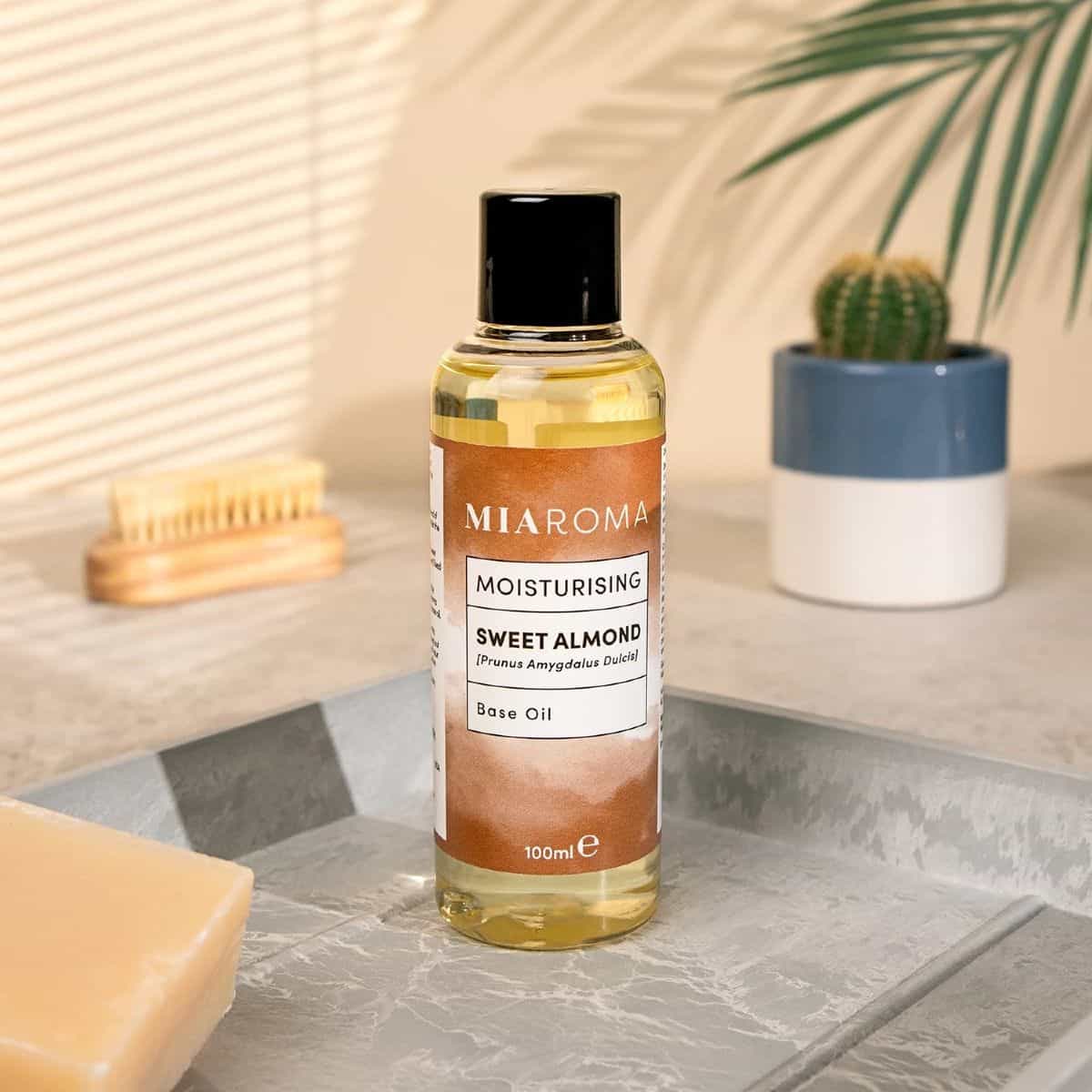 Bottle of Miaroma sweet almond oil in a bathroom